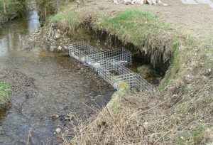 gabions in river being filled