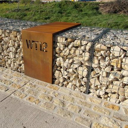 gabion wall with modern house number